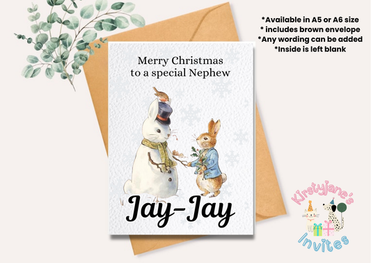 Christmas greetings card Peter Rabbit winter snowman